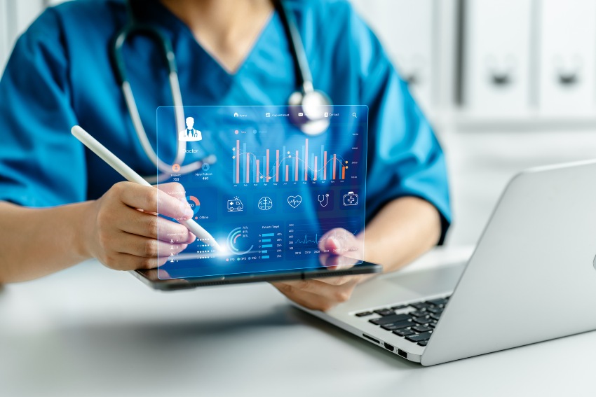 Healthcare professional using a tablet with showcasing data driven analytics dashboard in California